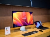 Side view of new Apple Computers MacBook Pro connected to the Studio Display 5k Retina monitor.