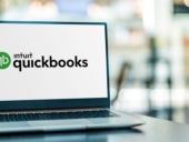 Laptop computer displaying logo of QuickBooks